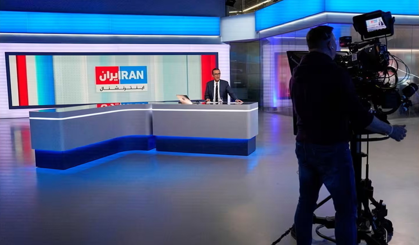 Reza Mohaddes presenting on Iran International © Carlos Jasso/AFP/Getty Images